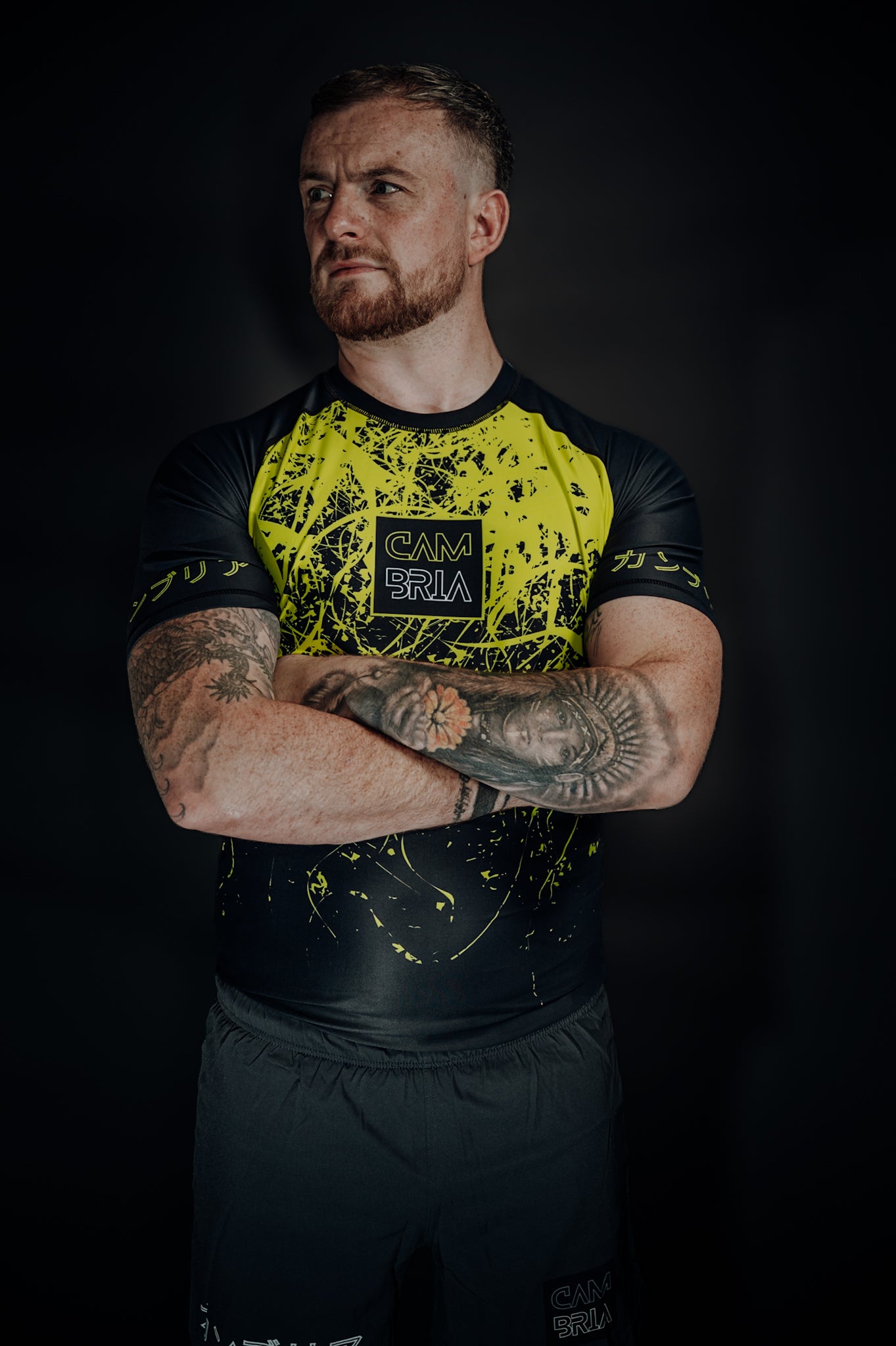 Cambria BJJ neon yellow and black rashguard for Brazilian Jiu-Jitsu, compression top with modern splatter design for training and competition