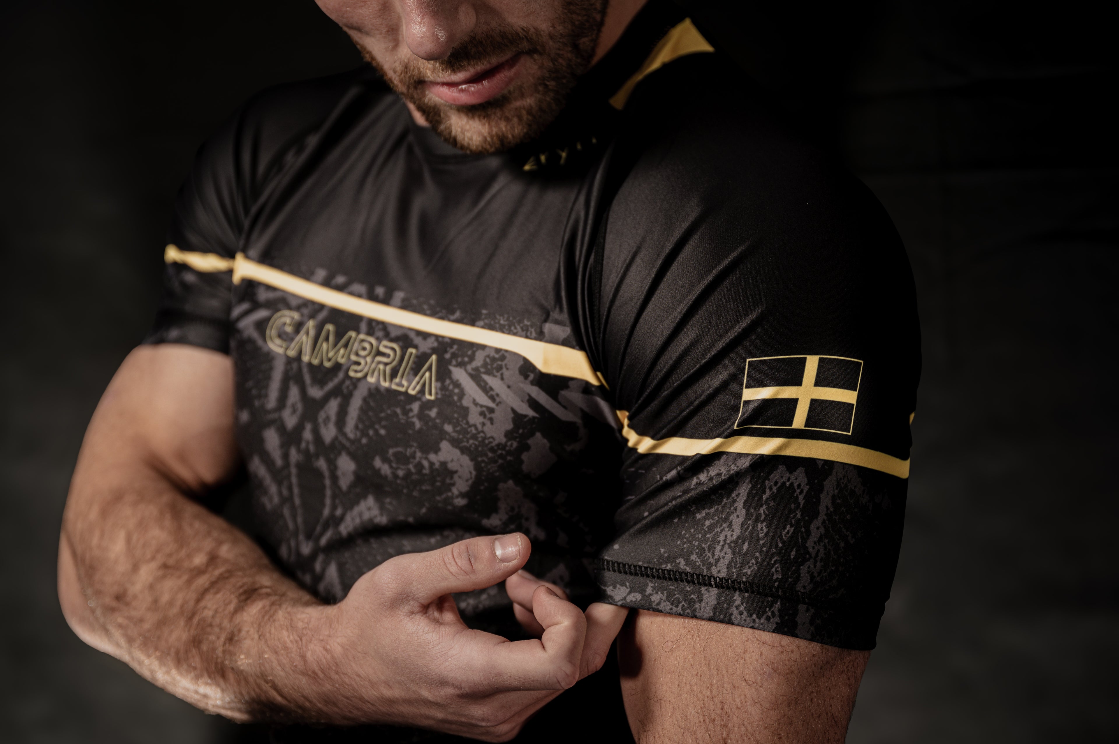 Cambria black and gold Brazilian Jiu-Jitsu rashguard with snakeskin pattern, compression top for no-gi BJJ training and competition