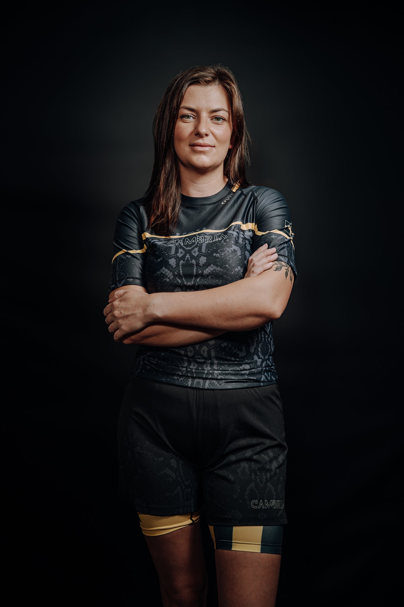 Cambria black and gold Brazilian Jiu-Jitsu rashguard with snakeskin pattern, compression top for no-gi BJJ training and competition. unisex - men and women.