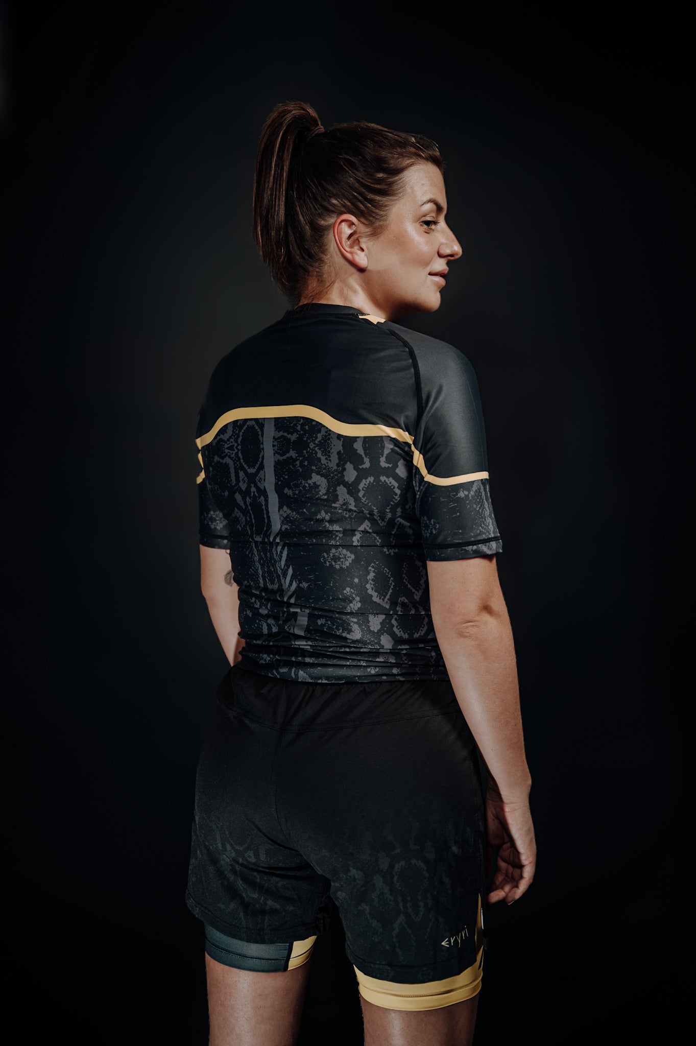 Cambria black and gold Brazilian Jiu-Jitsu rashguard with snakeskin pattern, compression top for no-gi BJJ training and competition. Unisex - Men and women.