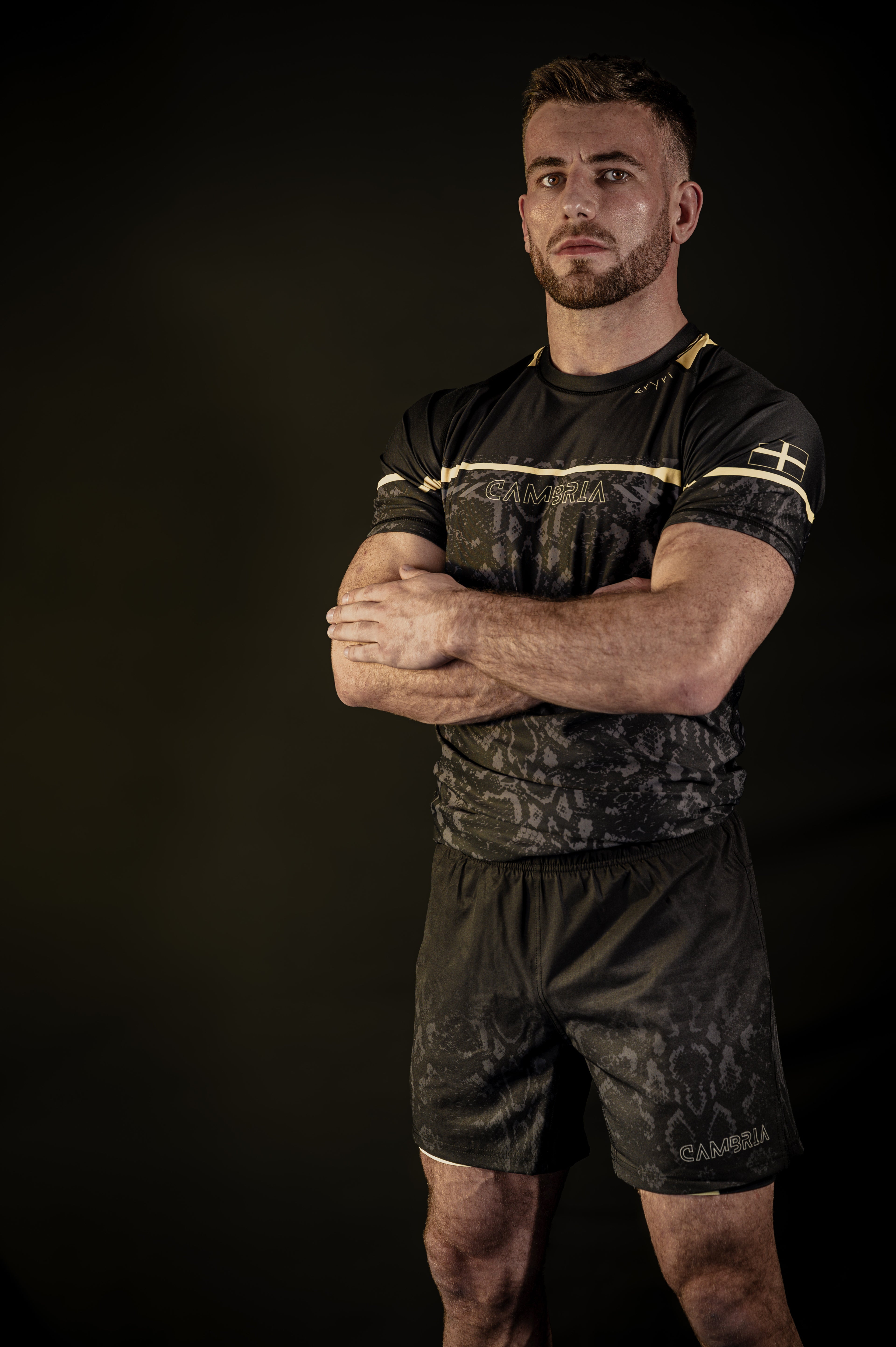 Cambria black and gold Brazilian Jiu-Jitsu rashguard with snakeskin pattern, compression top for no-gi BJJ training and competition